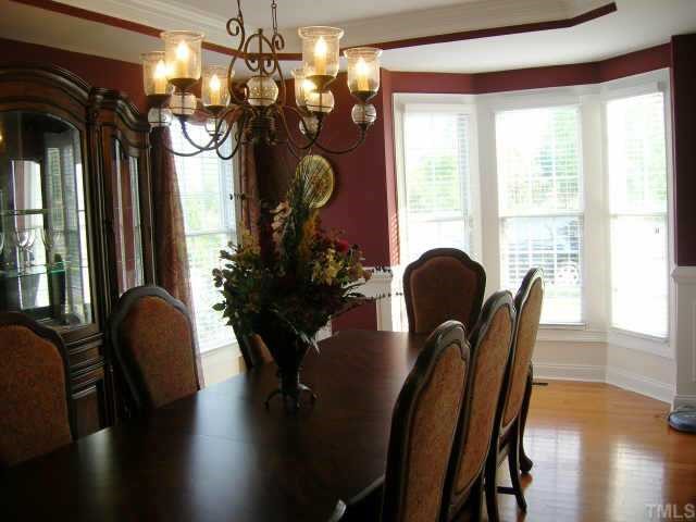 115 Rozelle Valley Lane Cary, NC 27519 - Photo 4 of 6 a view of a dining room with furniture and window