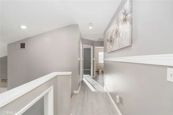 a view of a hallway view with staircase