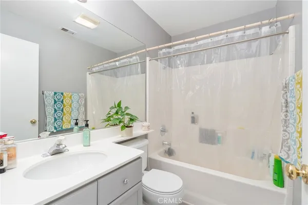 a bathroom with a sink a toilet and a bathtub