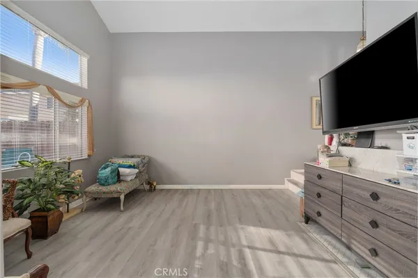 a room with furniture and a flat screen tv