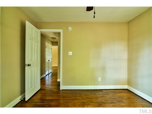 711 Tyler Road Raleigh, NC 27604 - Photo 14 of 24 a view of hallway with wooden floor