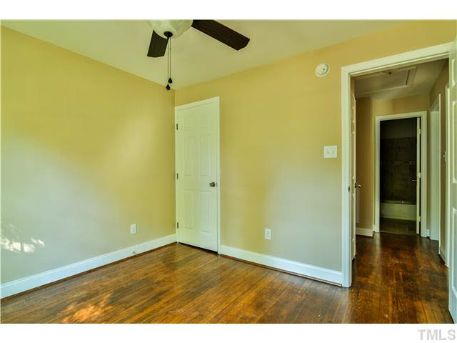 711 Tyler Road Raleigh, NC 27604 - Photo 15 of 24 a view of empty room with wooden floor