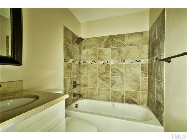 711 Tyler Road Raleigh, NC 27604 - Photo 20 of 24 a bathroom with a sink and a bathtub