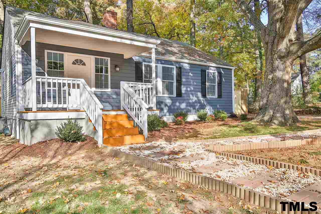 711 Tyler Road Raleigh, NC 27604 - Photo 3 of 24 a view of a house with backyard and sitting area