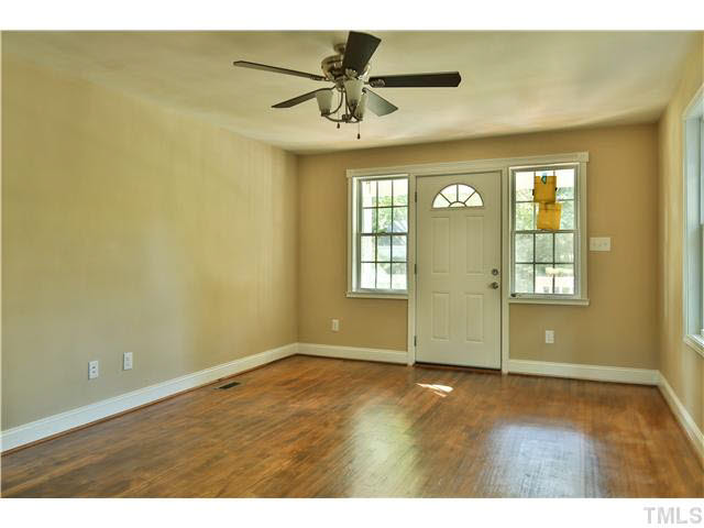 711 Tyler Road Raleigh, NC 27604 - Photo 7 of 24 an empty room with a window and ceiling fan
