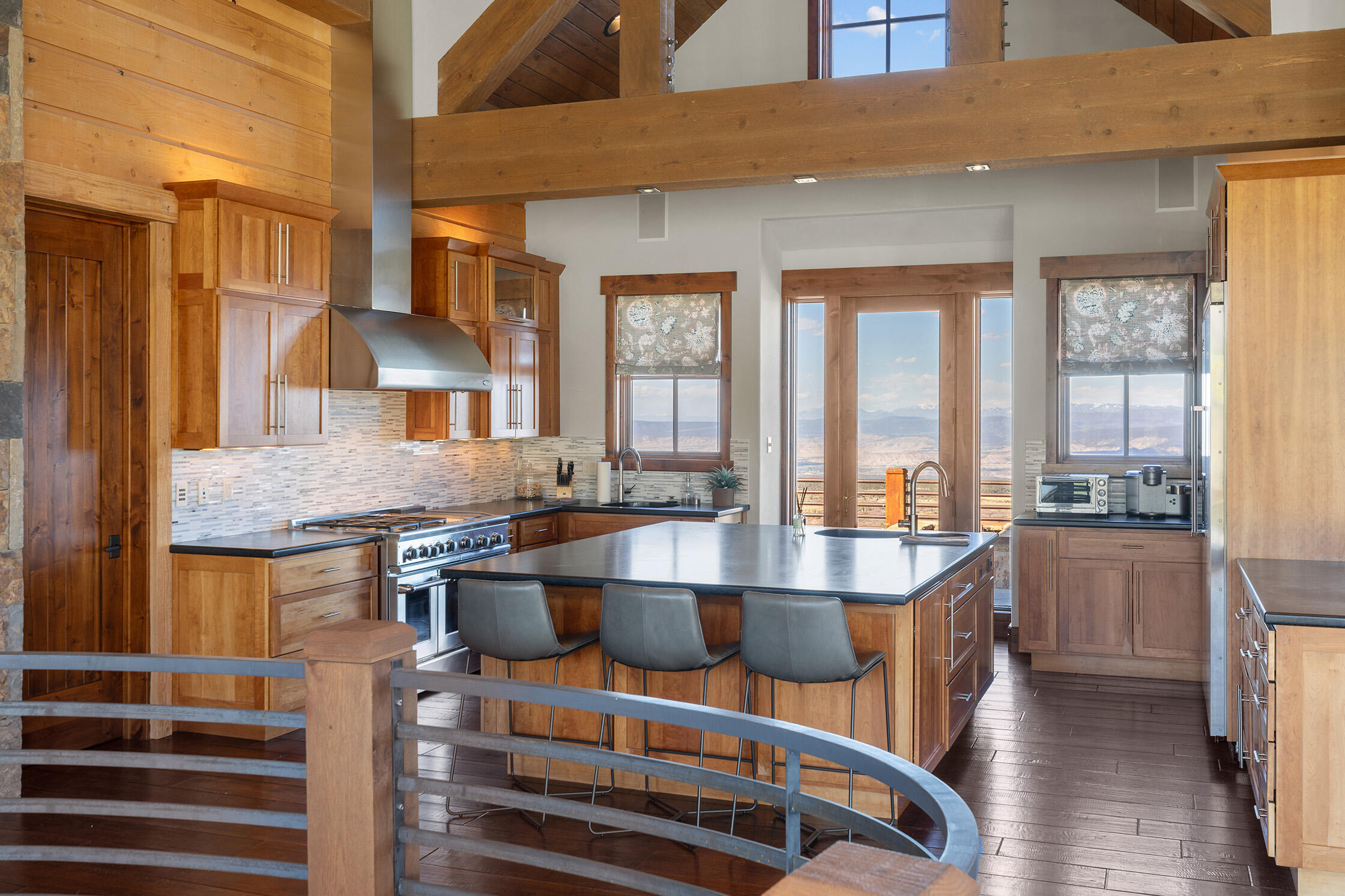 1221 Cornerstone Loop Montrose, CO 81403 - Photo 13 of 44 a dining hall with stainless steel appliances granite countertop a stove and a dining table chair