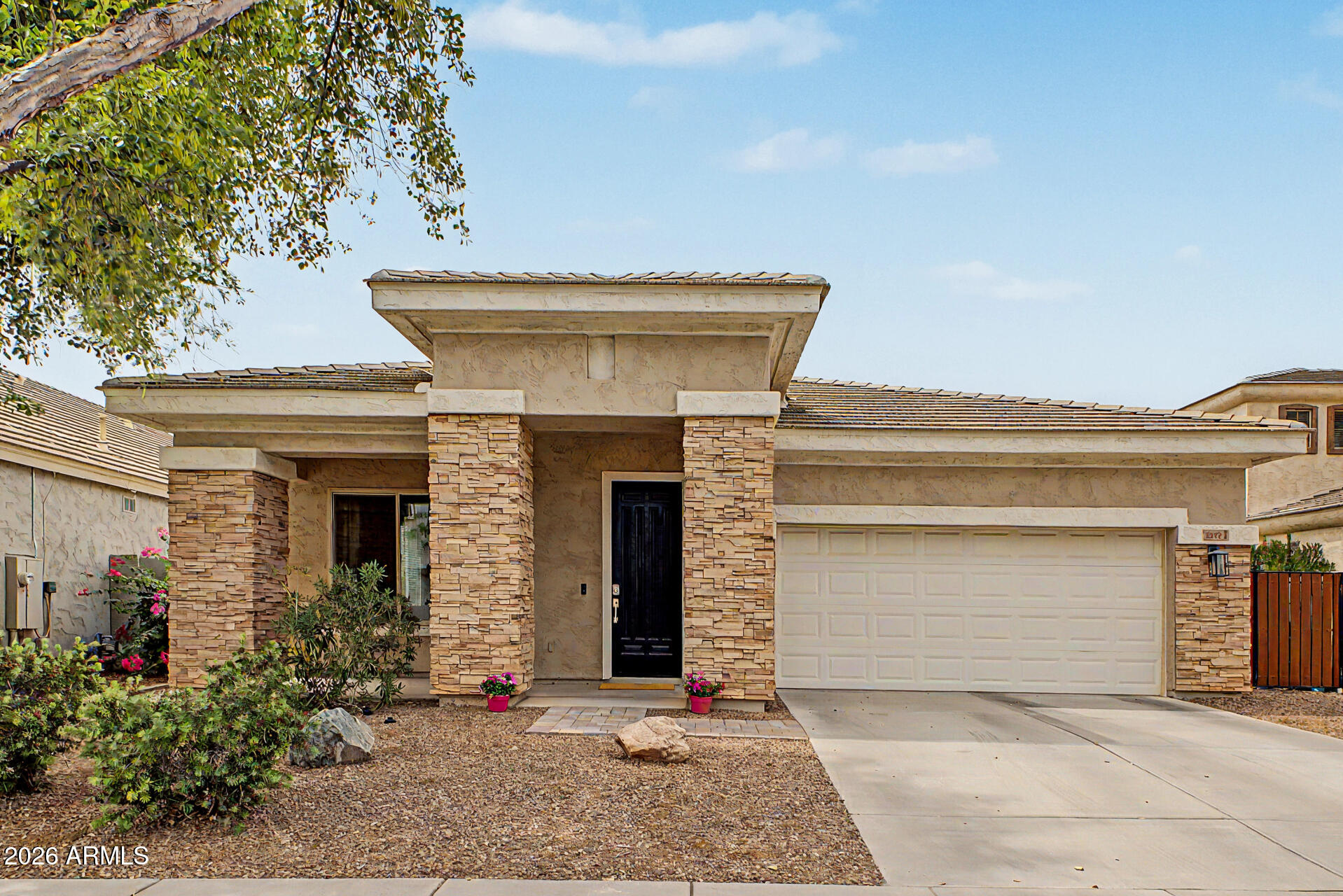 4272 East Buckboard Road Gilbert, AZ 85297 - Photo 1 of 37 a front view of a house with garage