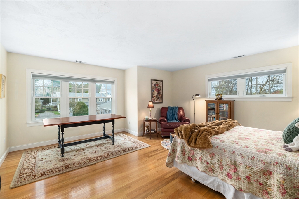 6 Essex Road, Unit 8 Ipswich, MA 01938 - Photo 22 of 35 a bedroom with a bed a table and a window