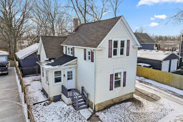 a aerial view of a house with a yard