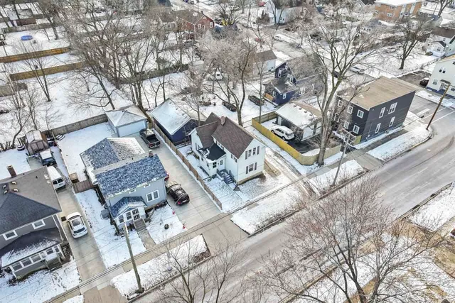 a picture of a bench in front of a wall