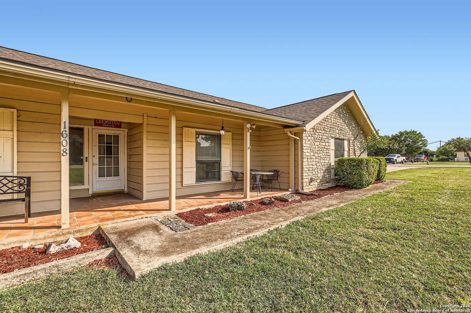 front view of a house with a patio