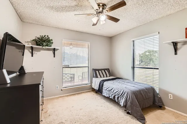 a bathroom with a sink toilet vanity and tub