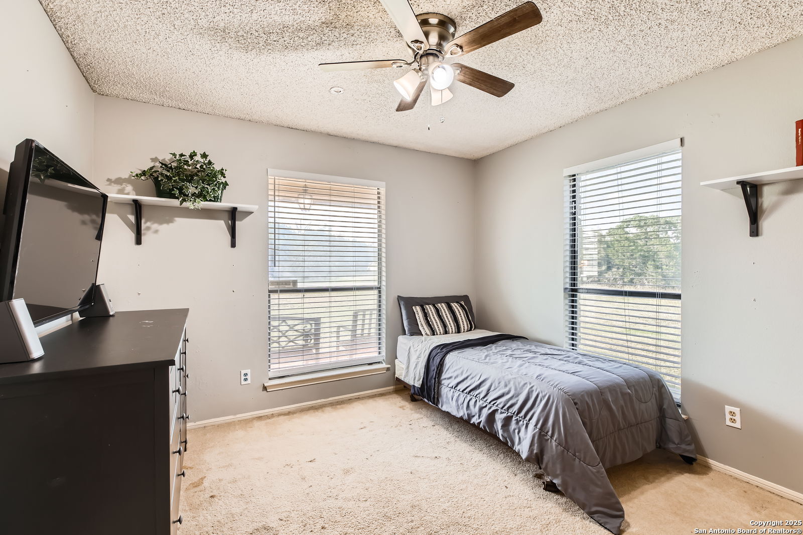 1608 Kings Ranch Road Bandera, TX 78003 - Photo 12 of 14 a bedroom with a bed and a desk