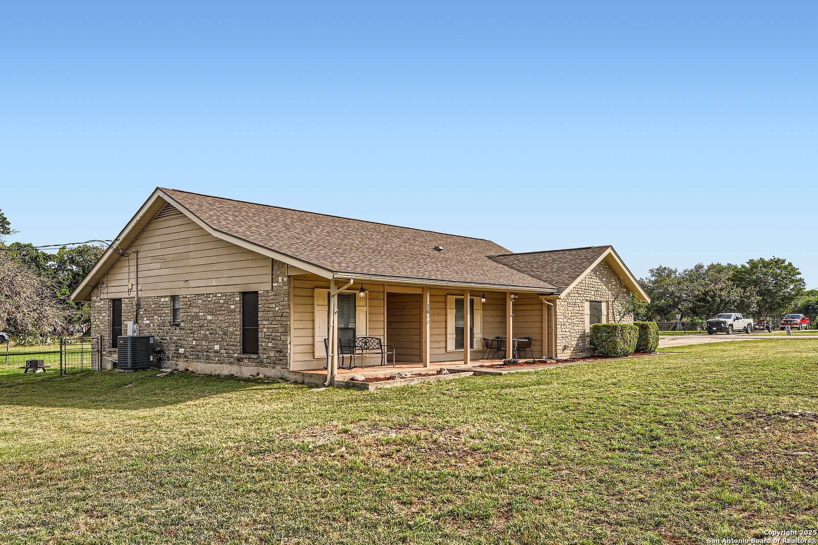 1608 Kings Ranch Road Bandera, TX 78003 - Photo 14 of 14 a front view of a house with a yard