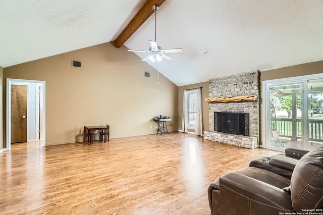 a view of work space with wooden floor and furniture