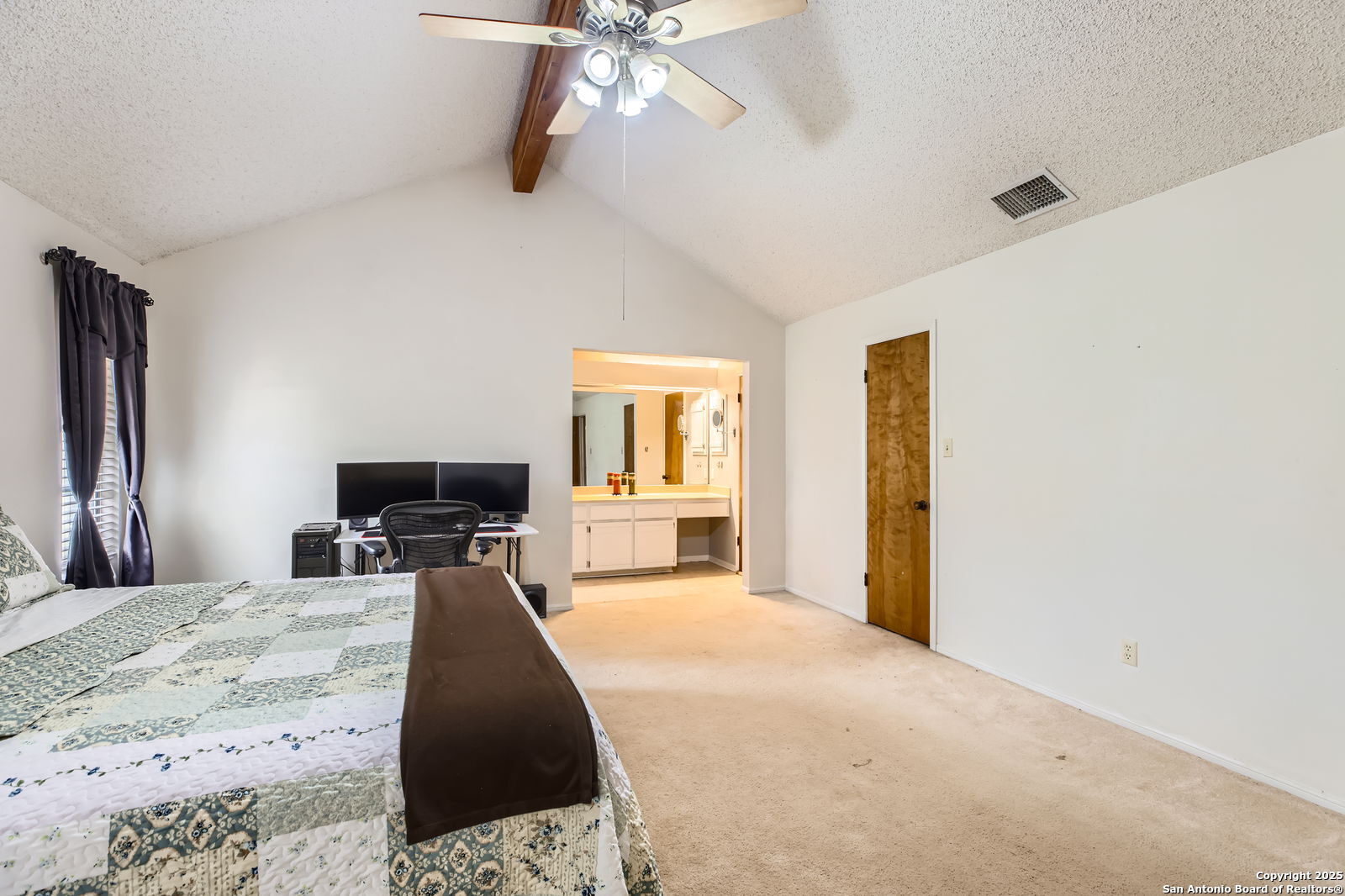 1608 Kings Ranch Road Bandera, TX 78003 - Photo 9 of 14 a bedroom with a bed and a flat screen tv