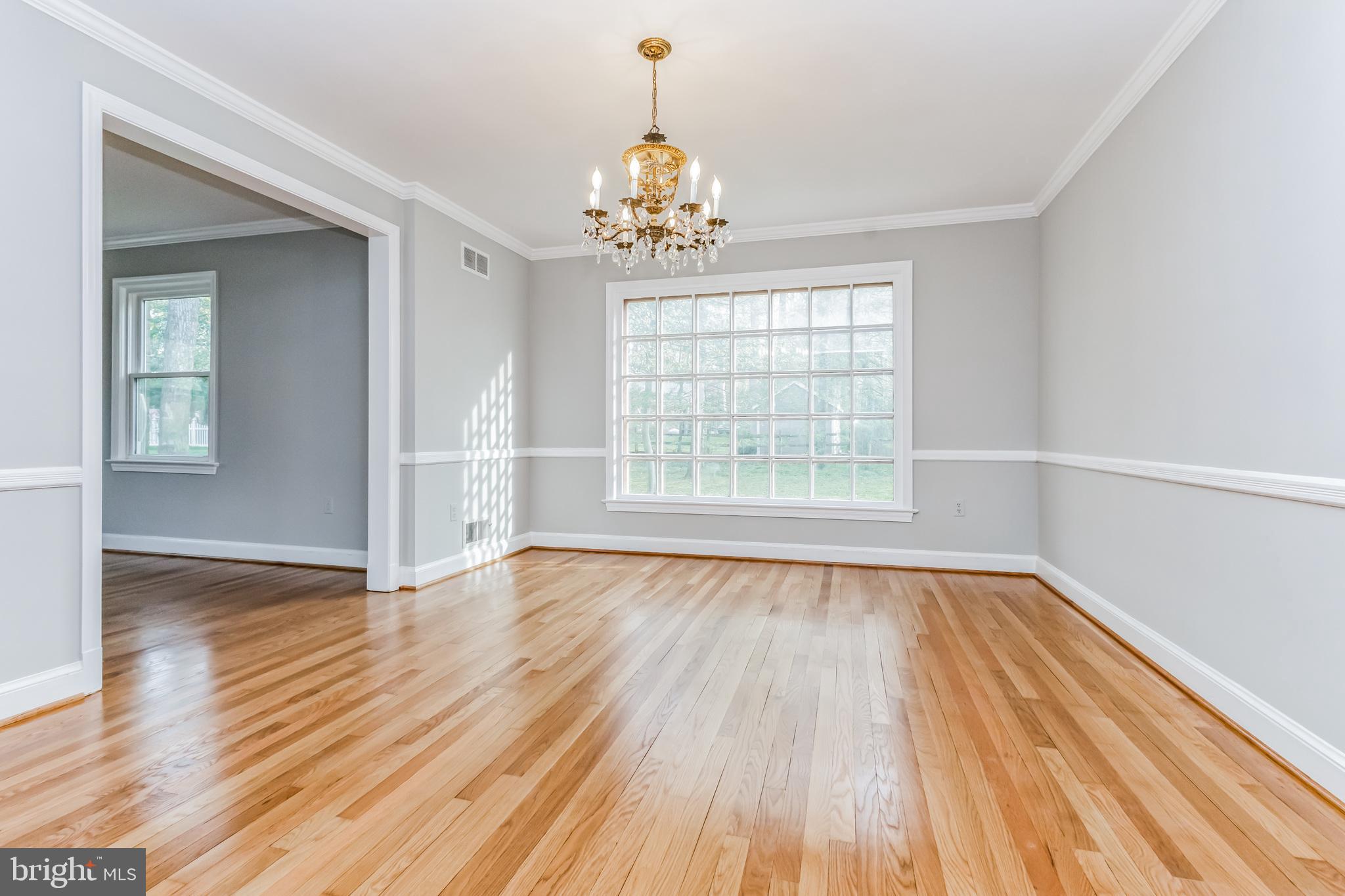 14315 Chesterfield Road Rockville, MD 20853 - Photo 16 of 33 Dining Room with Chair Rail and Crown Molding