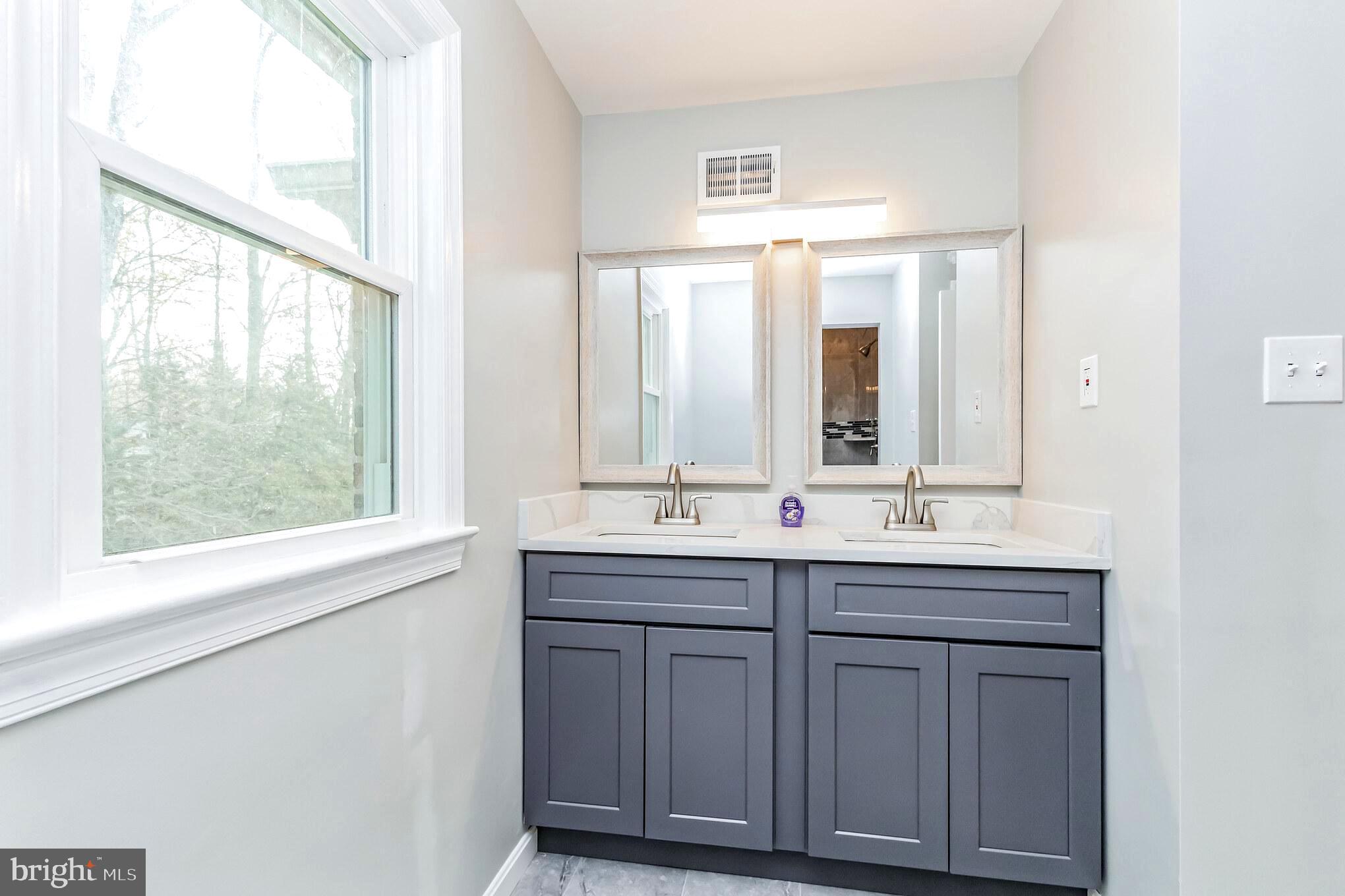 14315 Chesterfield Road Rockville, MD 20853 - Photo 21 of 33 Primary Bathroom with Double-Sink & Walk-In Shower