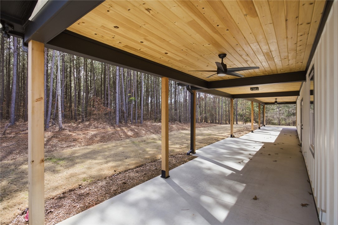 147 McAlister Road West Union, SC 29696 - Photo 34 of 49 This inviting covered patio offers tranquil views of the surrounding natural landscape.