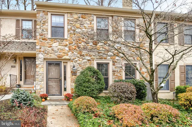 front view of a brick house with a large windows