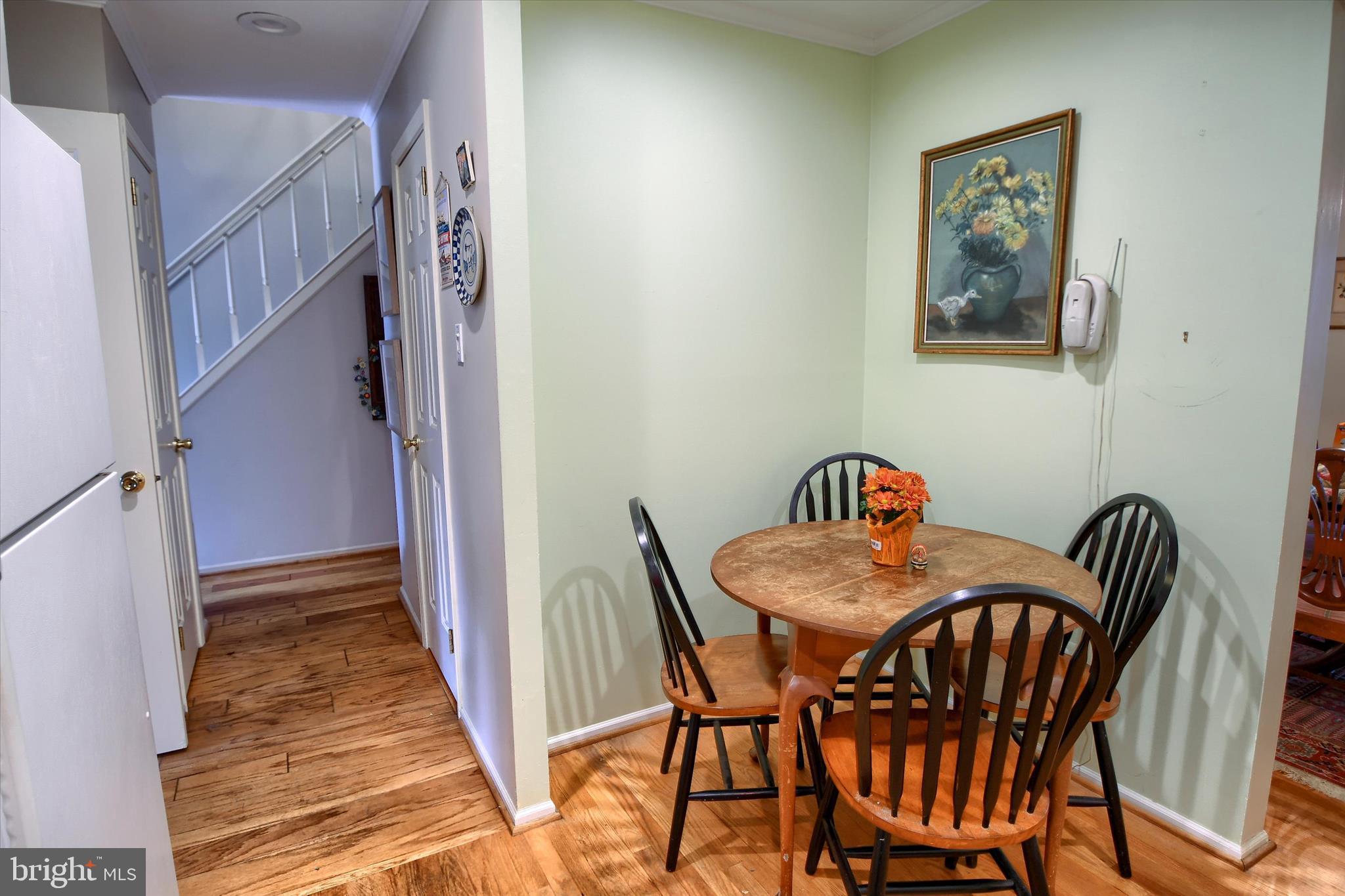 1304 Weatherstone Drive, Unit 1304 Paoli, PA 19301 - Photo 11 of 35 a view of a dining room with furniture and wooden floor