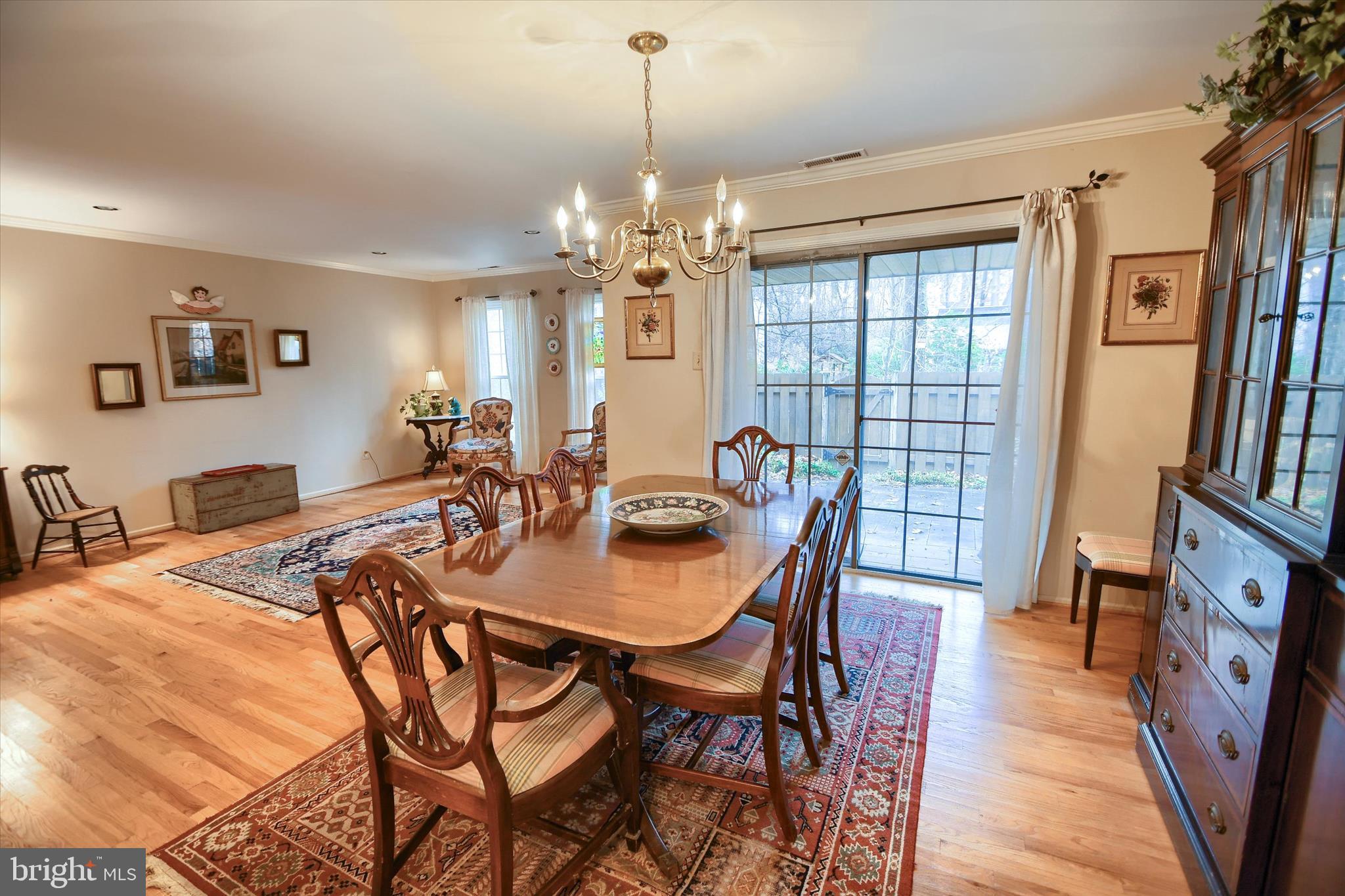 1304 Weatherstone Drive, Unit 1304 Paoli, PA 19301 - Photo 12 of 35 a view of a dining room with furniture and a chandelier