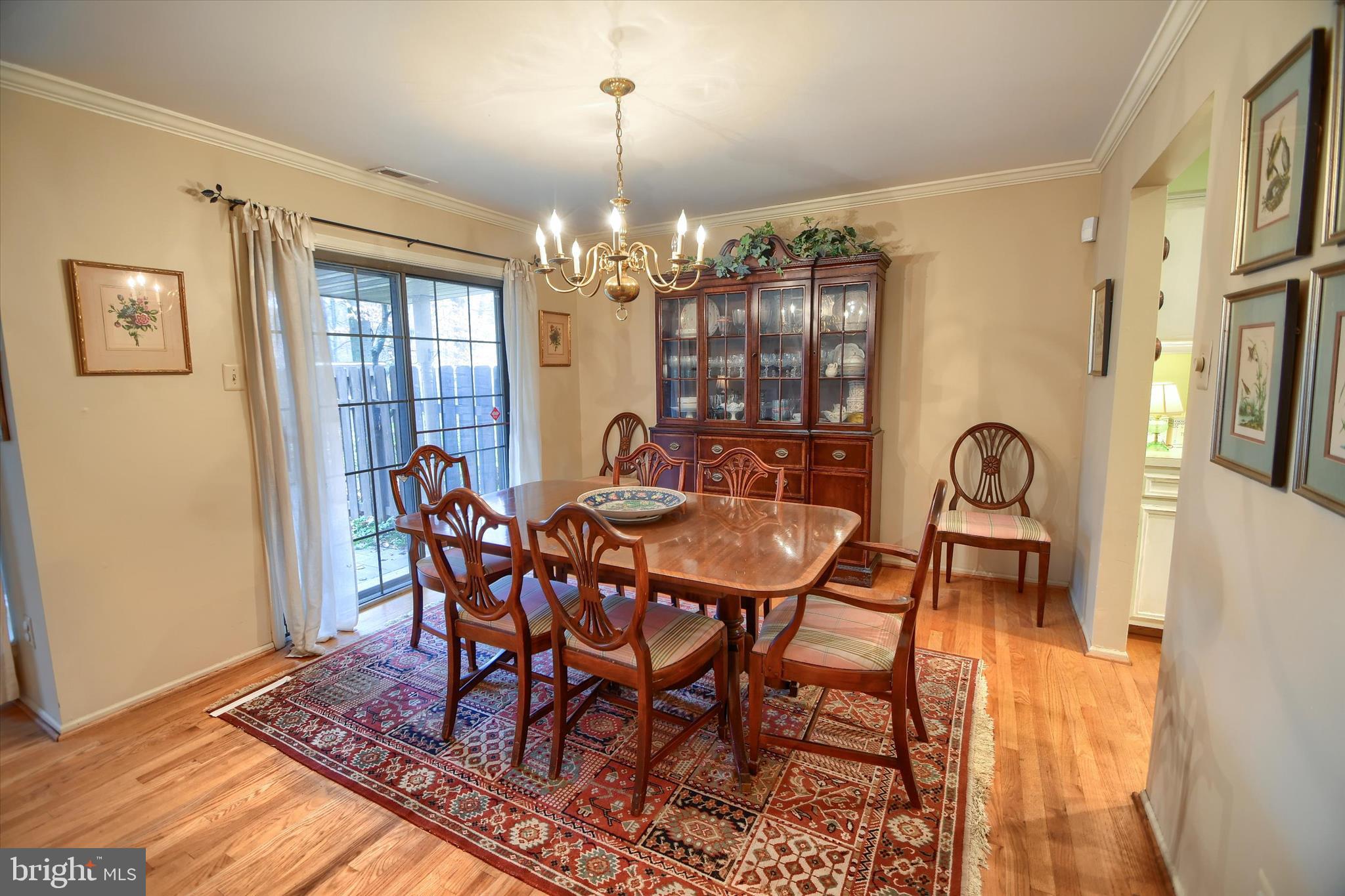 1304 Weatherstone Drive, Unit 1304 Paoli, PA 19301 - Photo 13 of 35 a view of a dining room with furniture and chandelier