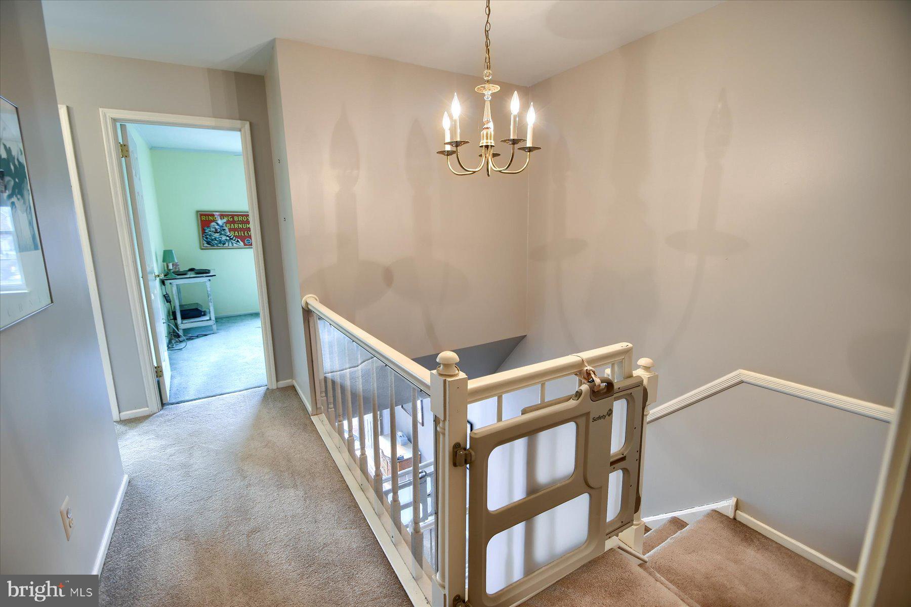 1304 Weatherstone Drive, Unit 1304 Paoli, PA 19301 - Photo 16 of 35 a view of a livingroom with wooden floor and stairs