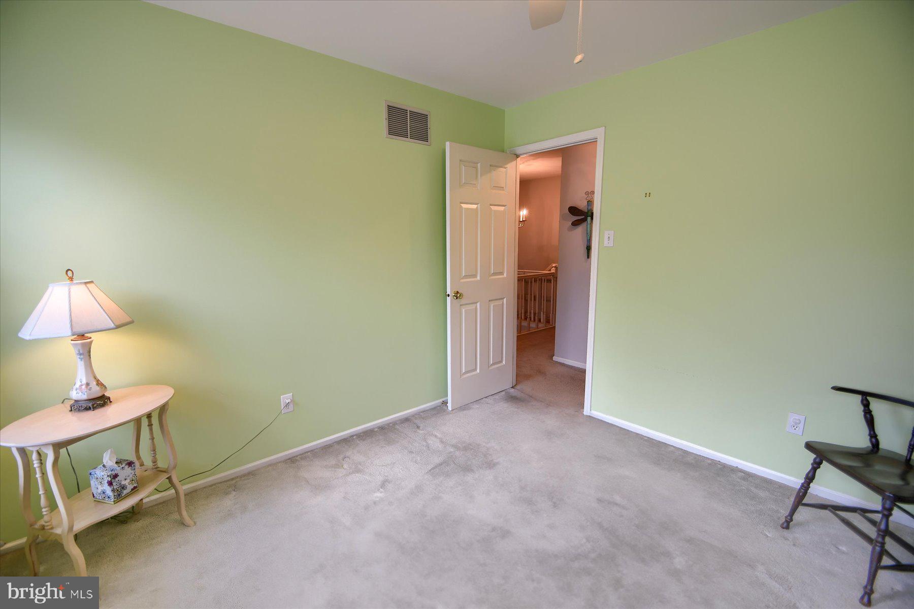 1304 Weatherstone Drive, Unit 1304 Paoli, PA 19301 - Photo 20 of 35 a view of room with furniture and wooden floor