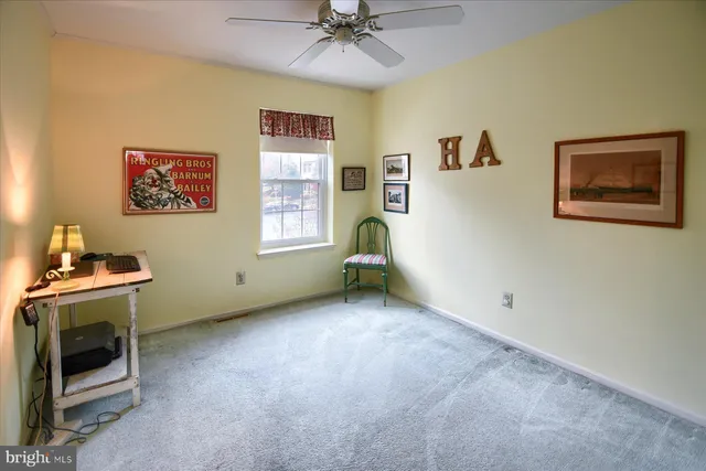 a view of a livingroom with a window and a fireplace