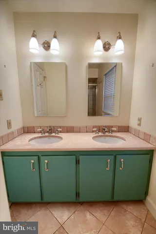 a bathroom with a sink and mirror