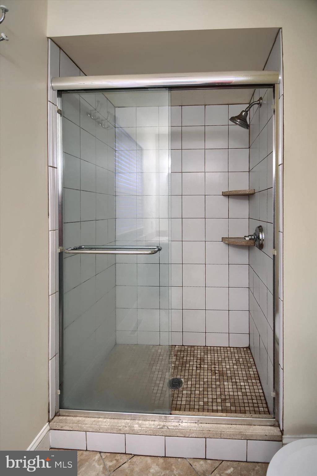 1304 Weatherstone Drive, Unit 1304 Paoli, PA 19301 - Photo 30 of 35 a bathroom with a shower