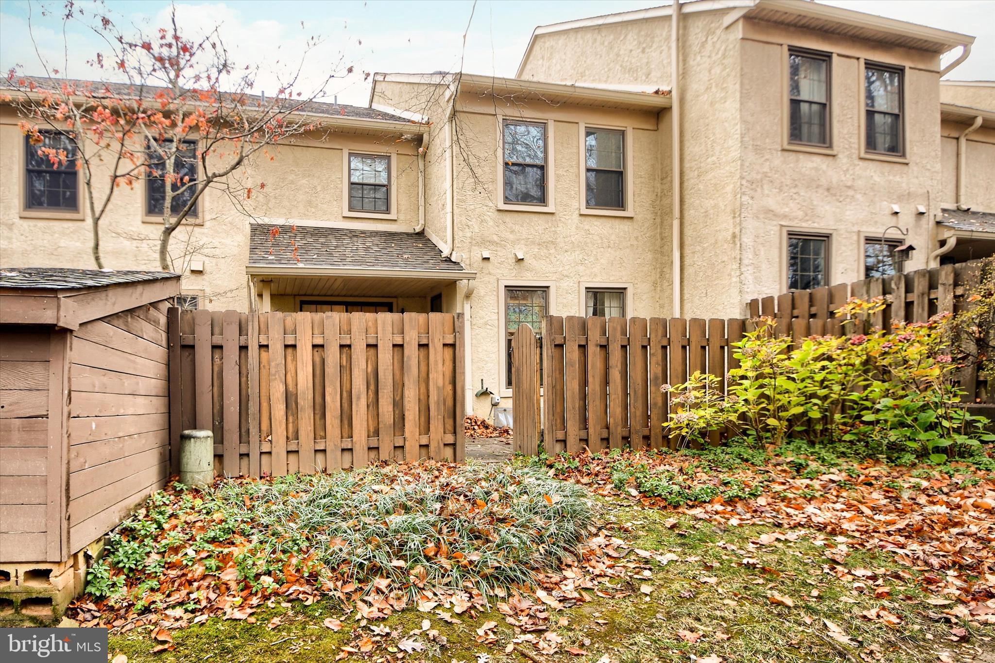 1304 Weatherstone Drive, Unit 1304 Paoli, PA 19301 - Photo 33 of 35 a front view of a house with a garden