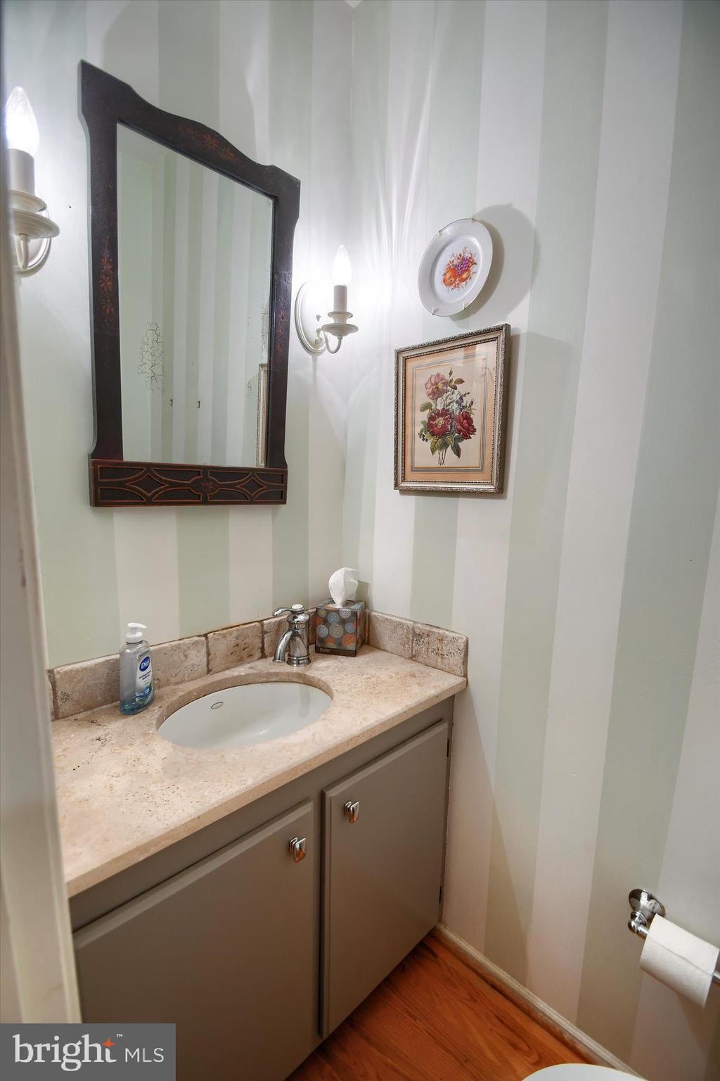 1304 Weatherstone Drive, Unit 1304 Paoli, PA 19301 - Photo 8 of 35 a bathroom with a sink and a mirror