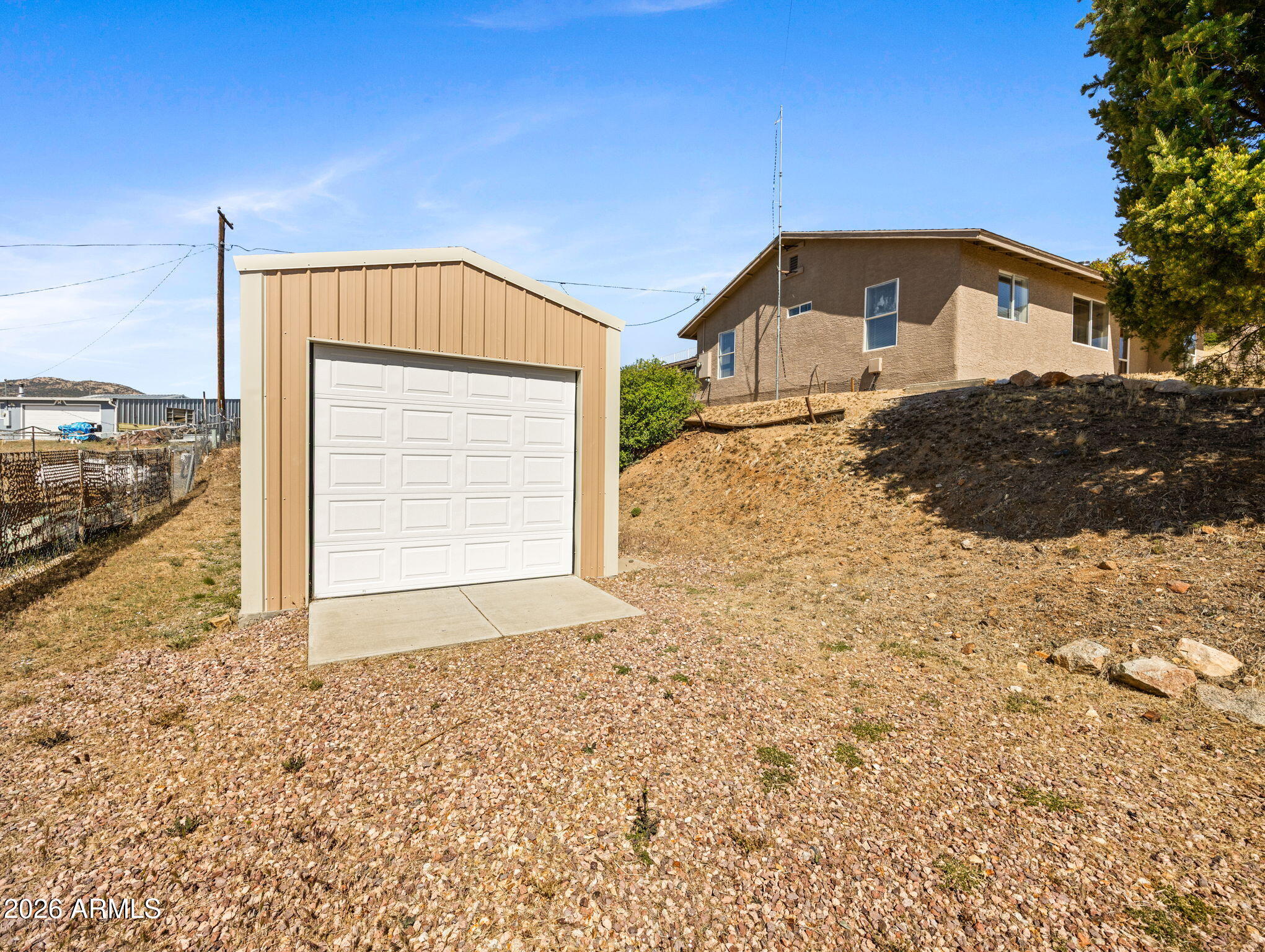 18420 Peeples Valley Road Peeples Valley, AZ 86332 - Photo 28 of 31 a front view of a house with a yard