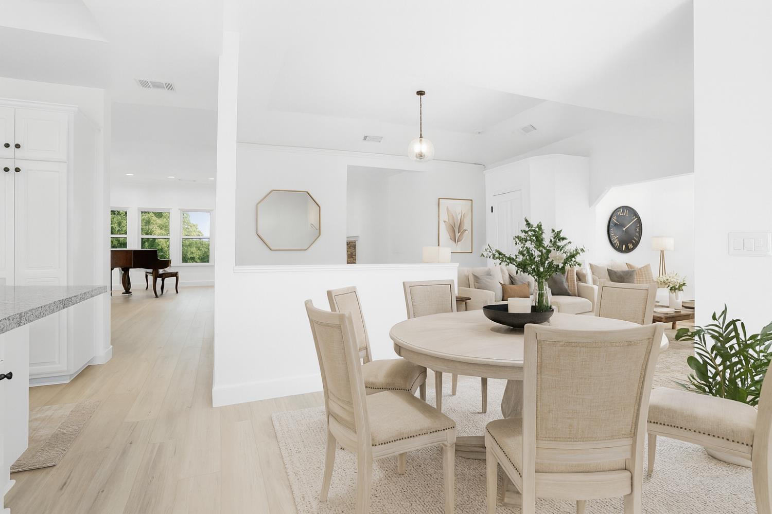 3740 North Lakeshore Boulevard Loomis, CA 95650 - Photo 12 of 67 Digitally altered and virtually staged dining room featuring light wood finished floors and baseboards
