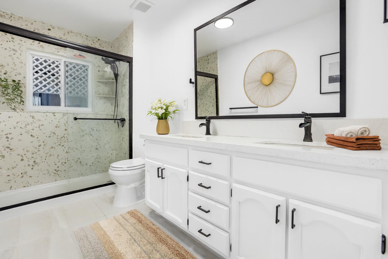 3740 North Lakeshore Boulevard Loomis, CA 95650 - Photo 43 of 67 Digitally altered and virtually staged bathroom with light tile patterned flooring, double vanity, and a stall shower