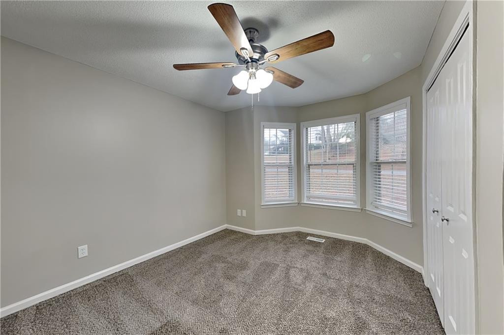 35 Amber Trace Dallas, GA 30132 - Photo 11 of 19 a view of an empty room with a window