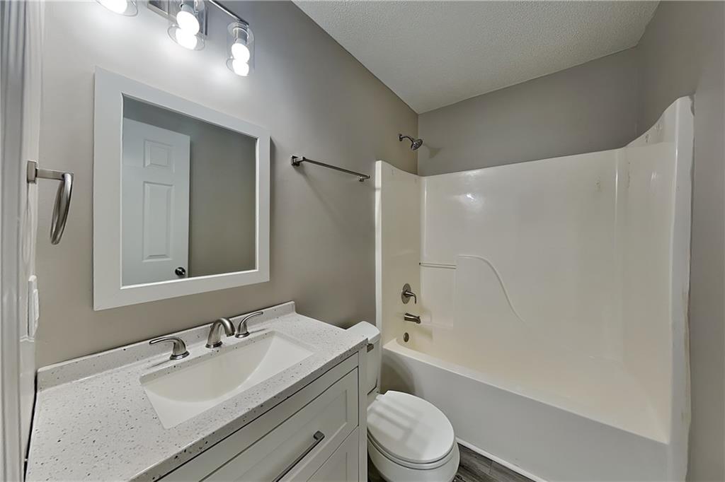 35 Amber Trace Dallas, GA 30132 - Photo 15 of 19 a bathroom with a sink a toilet and shower