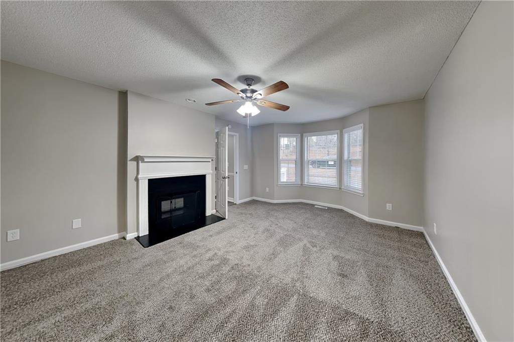 35 Amber Trace Dallas, GA 30132 - Photo 6 of 19 a view of an empty room with a fireplace