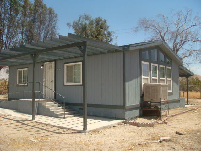 12972 Emerald Drive Whitewater, CA 92282 - Photo 1 of 55 a view of a house with snow on the road