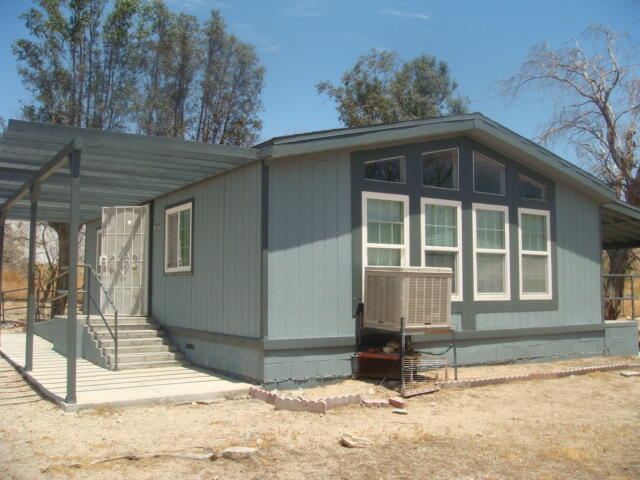 12972 Emerald Drive Whitewater, CA 92282 - Photo 39 of 55 a front view of a house with a yard