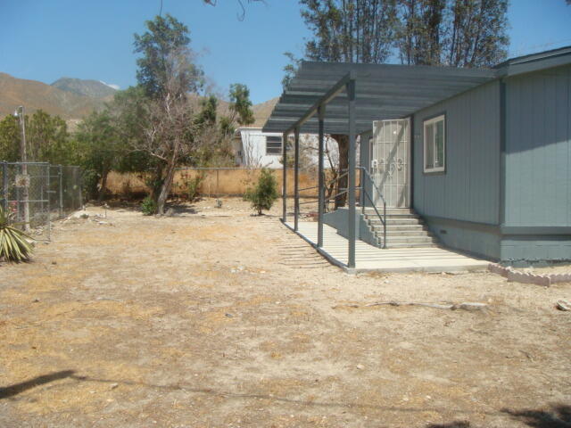 12972 Emerald Drive Whitewater, CA 92282 - Photo 42 of 55 a view of a yard with a tree