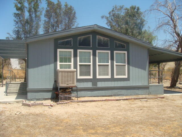 12972 Emerald Drive Whitewater, CA 92282 - Photo 5 of 55 a front view of a house with a yard