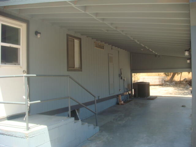 12972 Emerald Drive Whitewater, CA 92282 - Photo 7 of 55 a hallway with a white stove next to a window