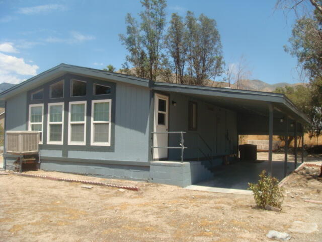 12972 Emerald Drive Whitewater, CA 92282 - Photo 9 of 55 a front view of a house with a yard