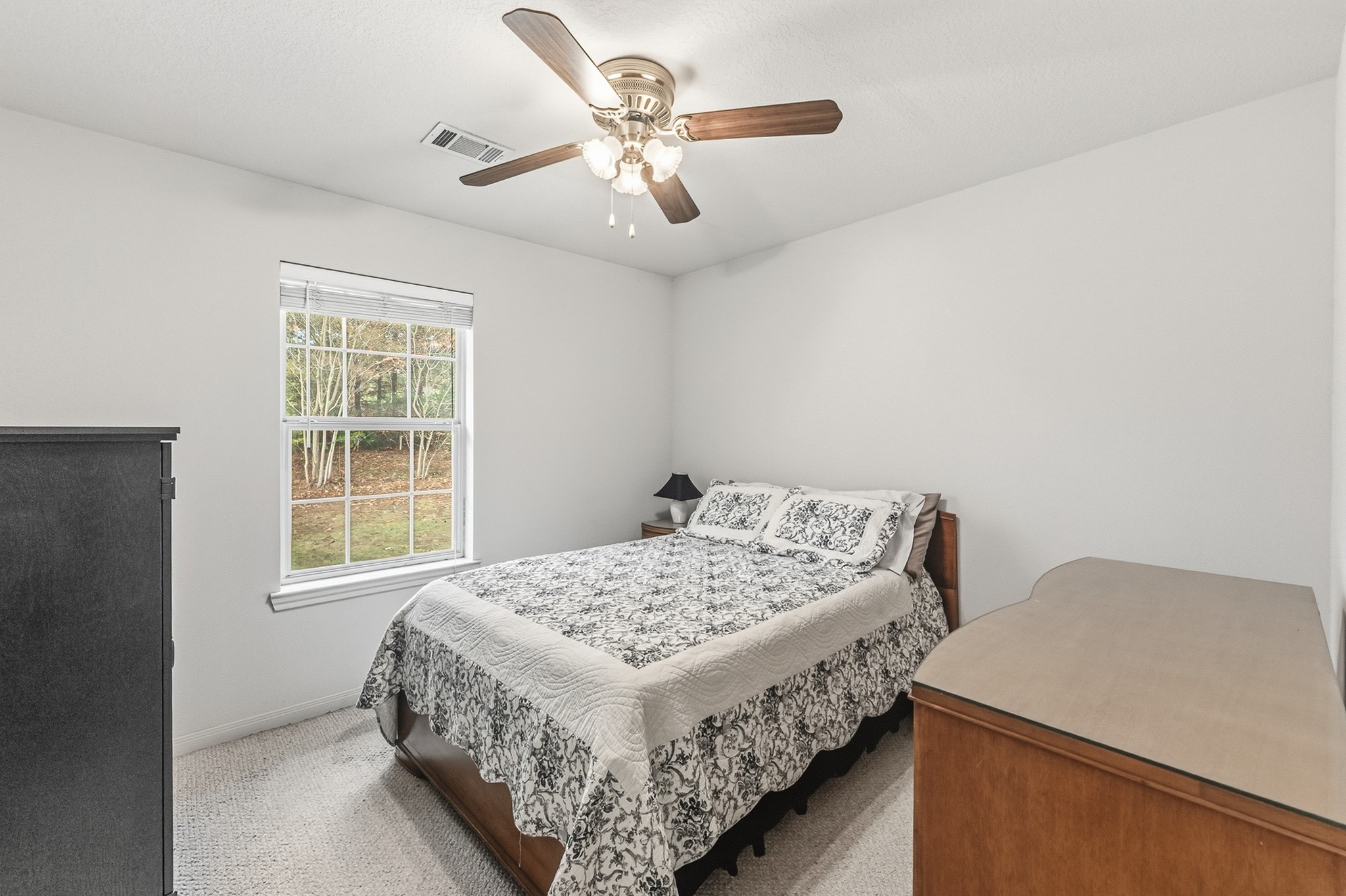 691 Bishop Road Huntsville, TX 77320 - Photo 22 of 32 a bedroom with a bed and a window