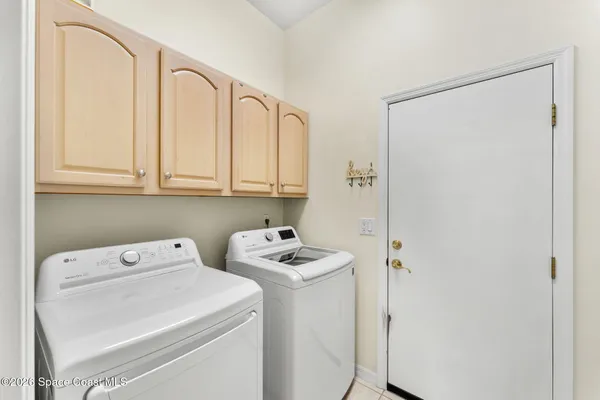a utility room with dryer and washer
