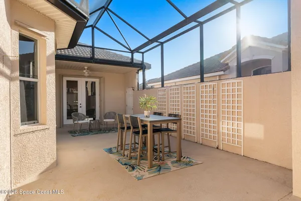 a patio with a table and chairs