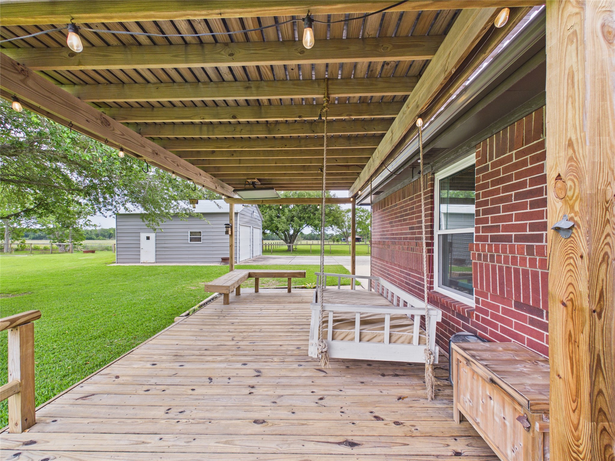 4610 Mustang Road Alvin, TX 77511 - Photo 43 of 50 Close up of the covered patio and detached metal garage/workshop.